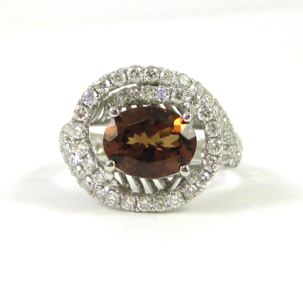 Appraisal: COLOR CHANGE GARNET AND DIAMOND RING The k white gold