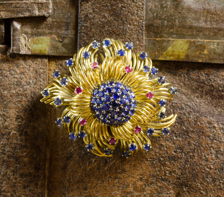 Appraisal: SAPPHIRE RUBY AND EIGHTEEN KARAT GOLD BROOCH The heavy yellow