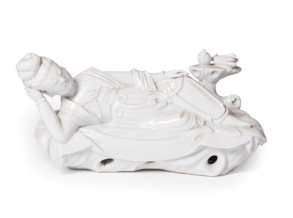 Appraisal: Chinese Blanc de Chine Porcelain Guanyin modeled reclining on leaf