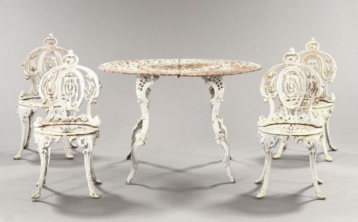 Appraisal: Late Victorian-Style Cast-Iron Circular Garden Table and Four Chairs presented