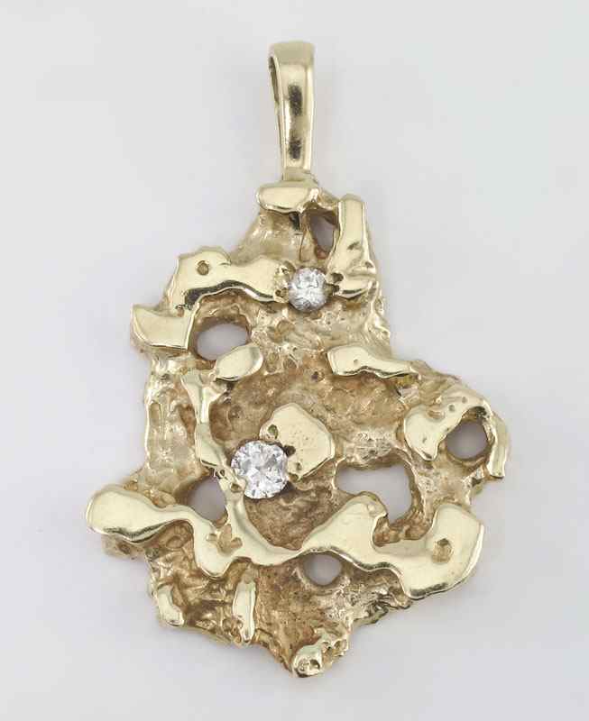 Appraisal: K DIAMOND NUGGET PENDANT K yellow gold nugget pendant contains