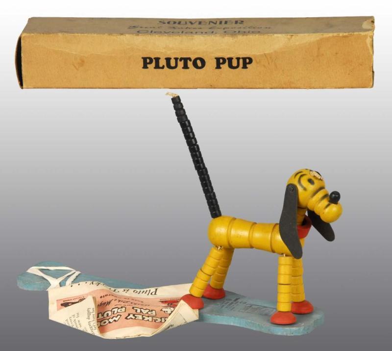 Appraisal: Fisher Price Pluto Pop-Up Paddle Toy Description American Includes rare