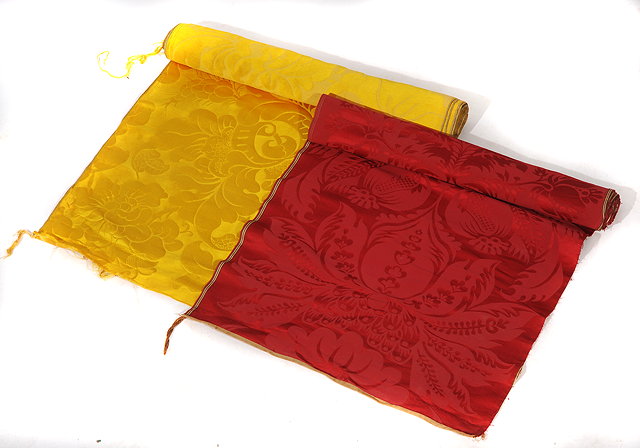 Appraisal: A LENGTH OF RED GROUND SILK MATERIAL cm wide and