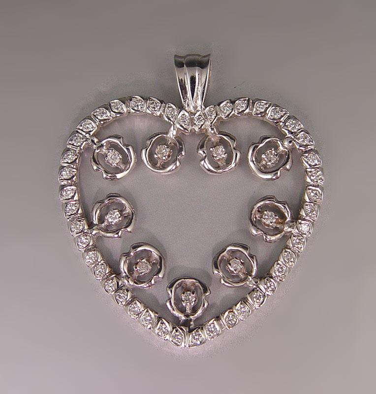 Appraisal: K DIAMOND ENCRUSTED HEART PENDANT k white gold heart shaped