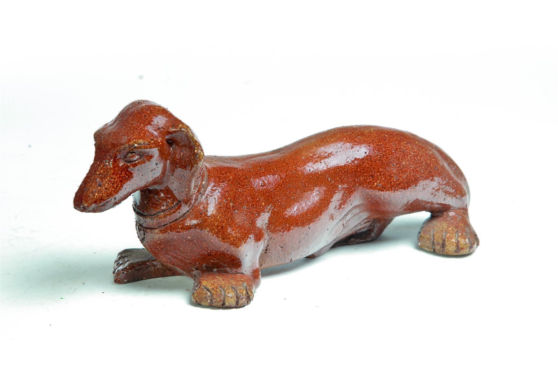 Appraisal: AMERICAN SEWERTILE DOG Twentieth century Dachshund incised W possibly for