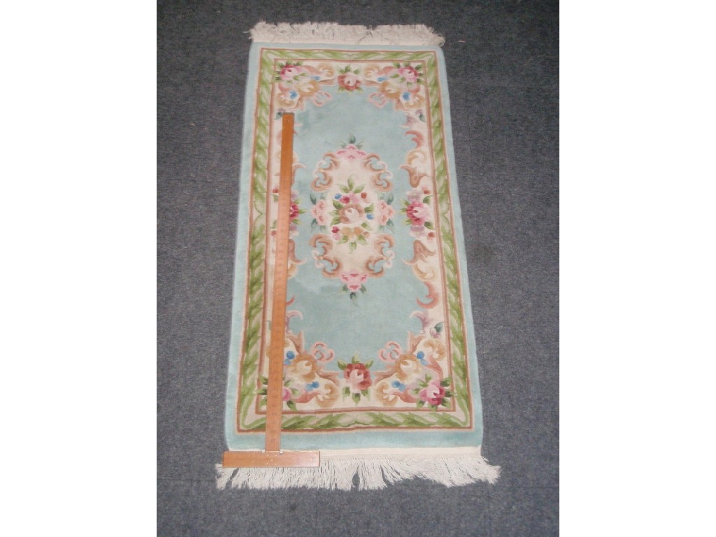 Appraisal: A Chinese hand cut wool rug cm x cm