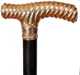 Appraisal: Gold Dress Cane- Ca - The gold-filled ornate handle of