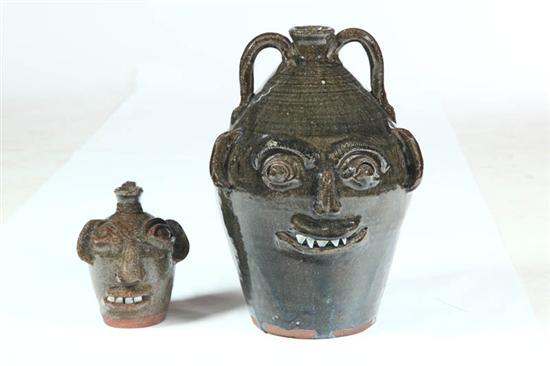 Appraisal: TWO GROTESQUE JUGS American th century redware Both marked for