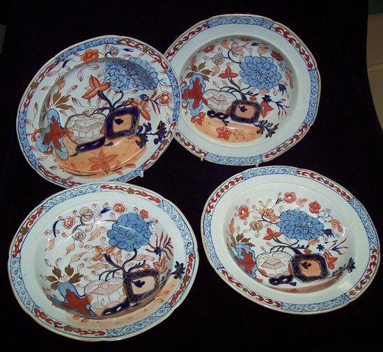 Appraisal: Four Masons Patent Ironstone bowls decorated gardens of flowers in