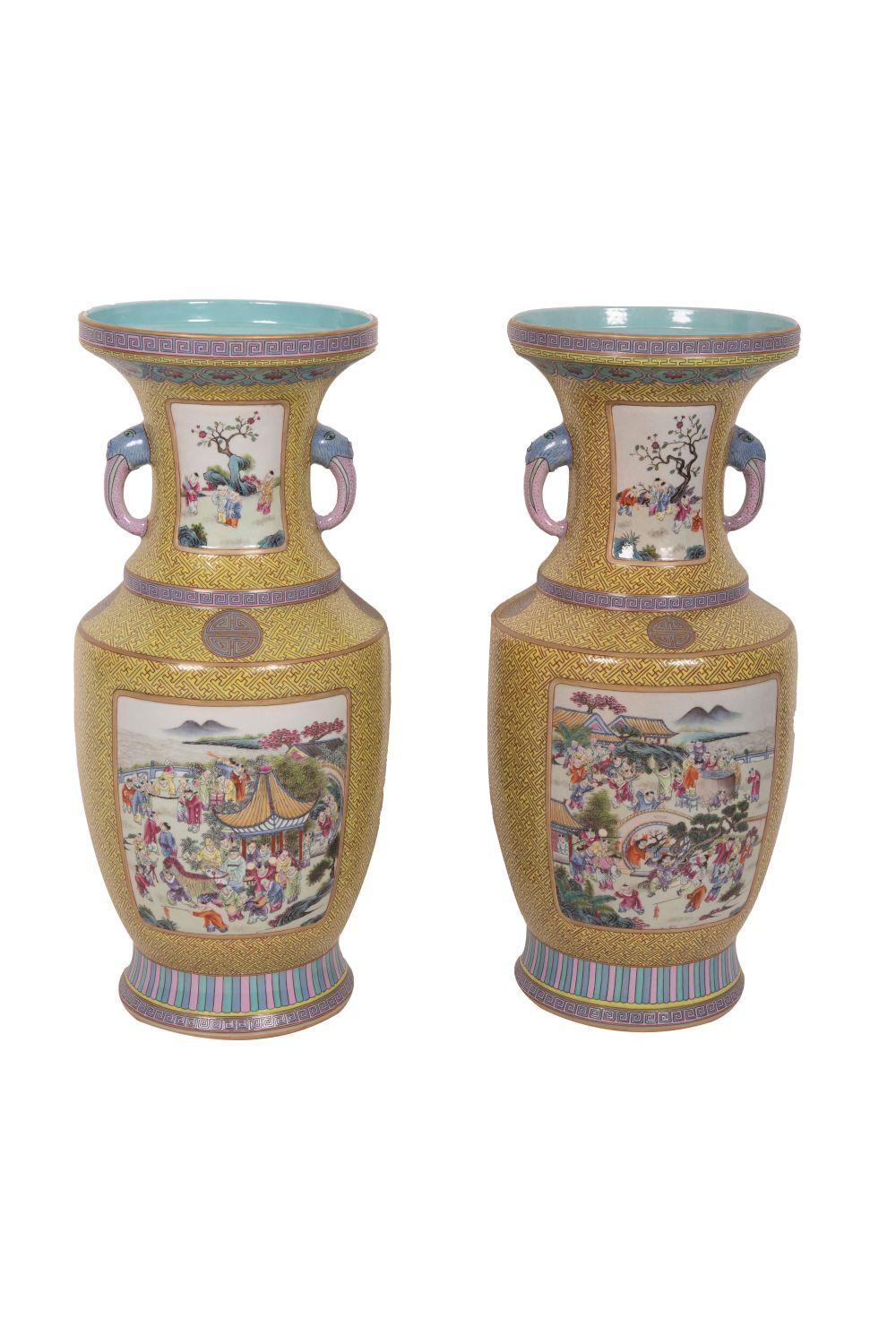 Appraisal: PAIR OF CHINESE POLYCHROME PORCELAIN TWO-HANDLE VASES inches high Condition