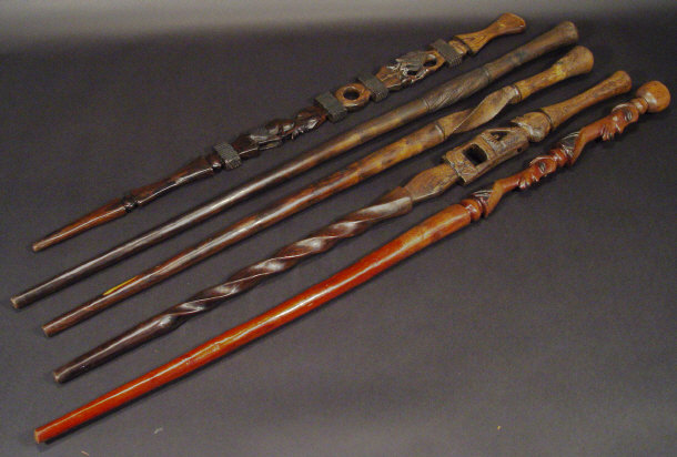 Appraisal: Five African hardwood walking canes each with carved decoration the