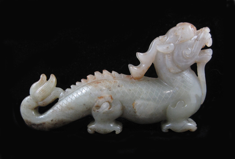 Appraisal: CHINESE CARVED JADE DRAGON SCULPTURE standing with head raised upward