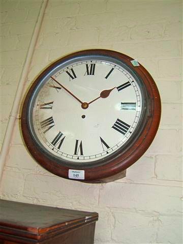 Appraisal: A mahogany dial clock with Roman numerals and single fusee