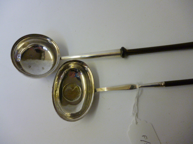 Appraisal: TWO GEORGIAN PUNCH LADLES one maker's mark BC London with