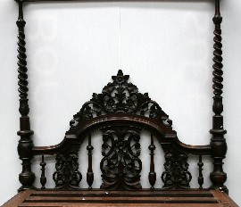 Appraisal: A four poster Calcutta bed headboard with central pierced carved