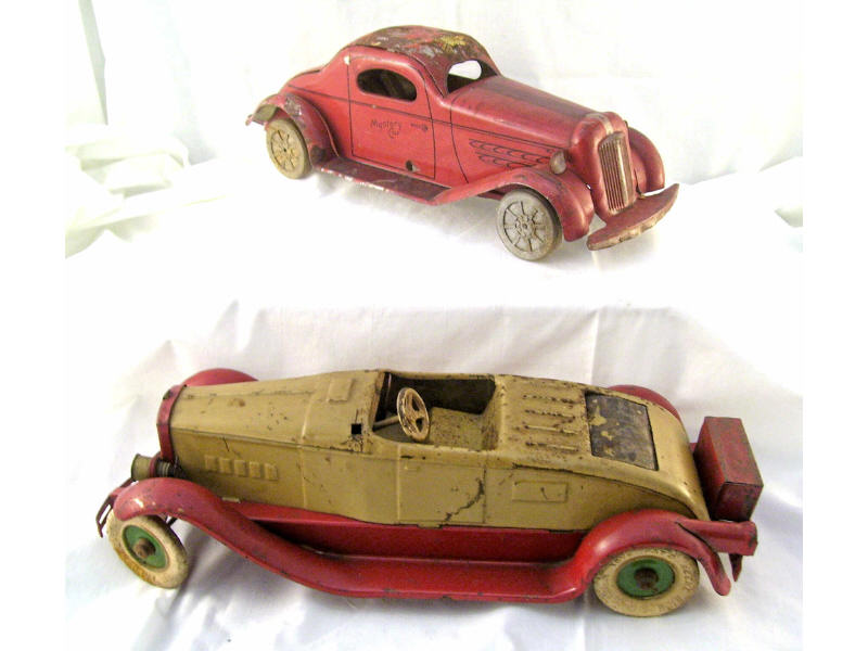 Appraisal: Tin Cars Lot Includes Kingsbury car with original orange red