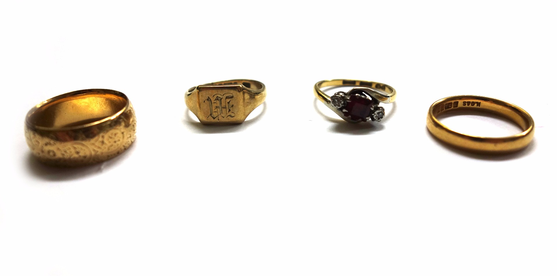 Appraisal: A collection of four rings comprising a ct gold wedding