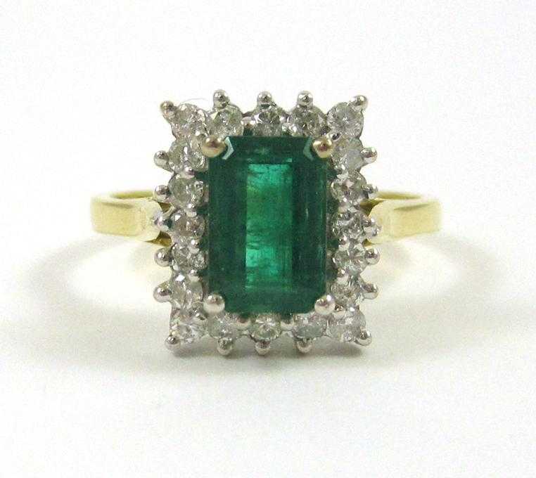 Appraisal: EMERALD DIAMOND AND EIGHTEEN KARAT GOLD RING The yellow and