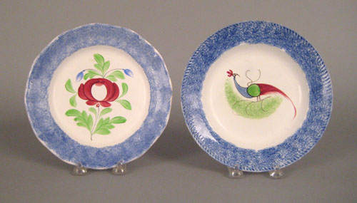 Appraisal: Two blue spatter plates th c with peafowl and rose