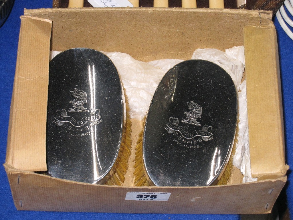 Appraisal: Pair of silver backed hair brushes