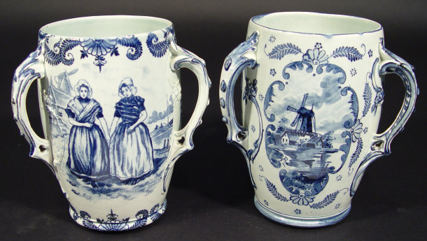 Appraisal: Pair of Delft three handled pottery vases printed with panels