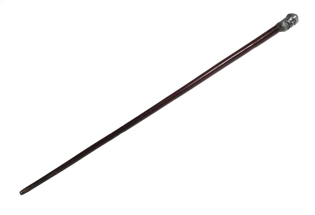 Appraisal: Wood walking stick cane long with a heavy cast-metal head