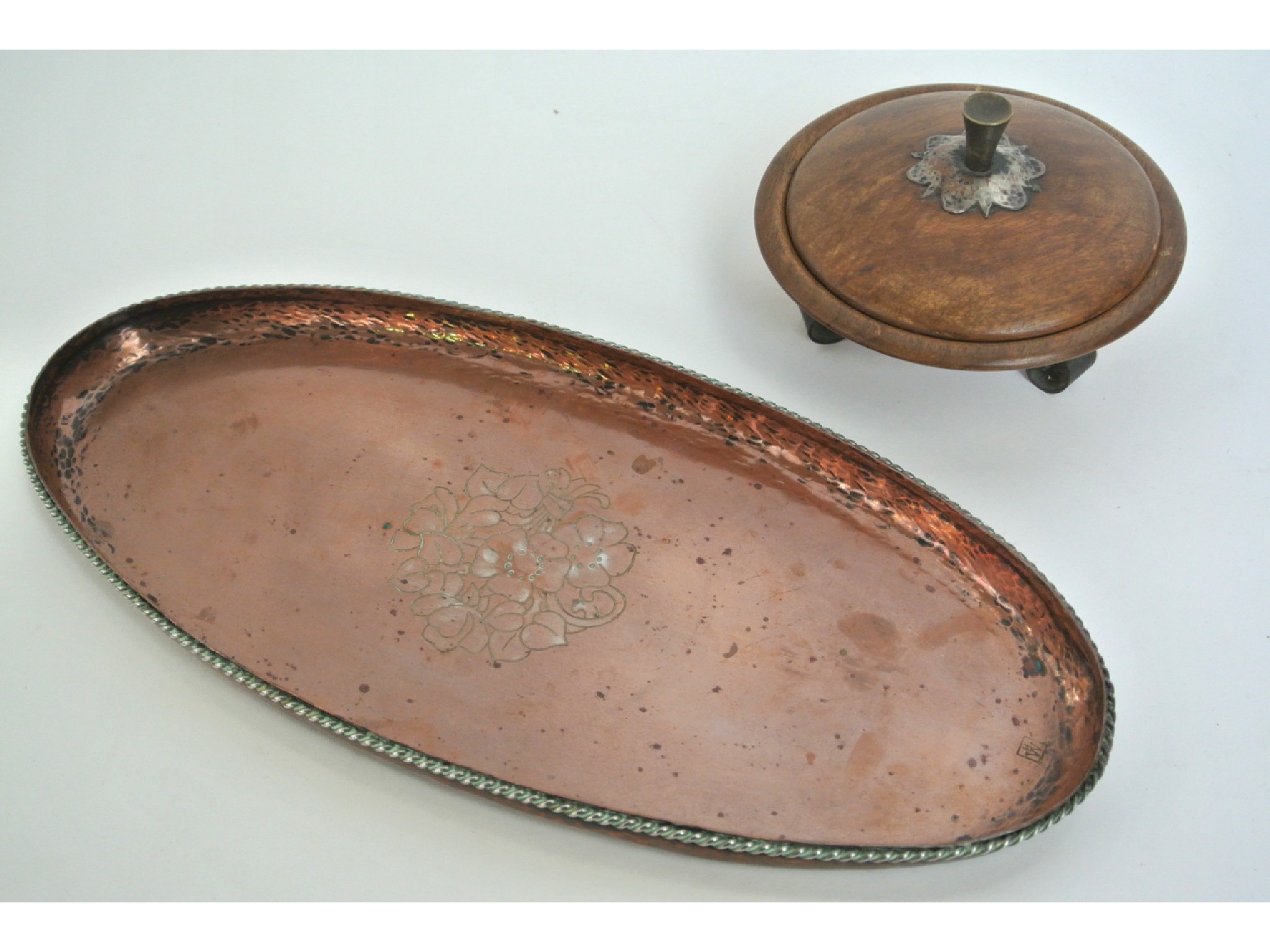 Appraisal: A small beaten copper dish of oval form with applied