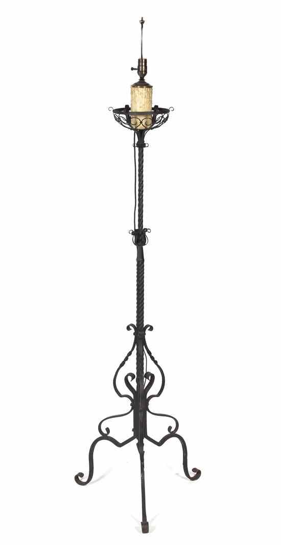 Appraisal: A Wrought Iron Torchiere having a twist standard over the