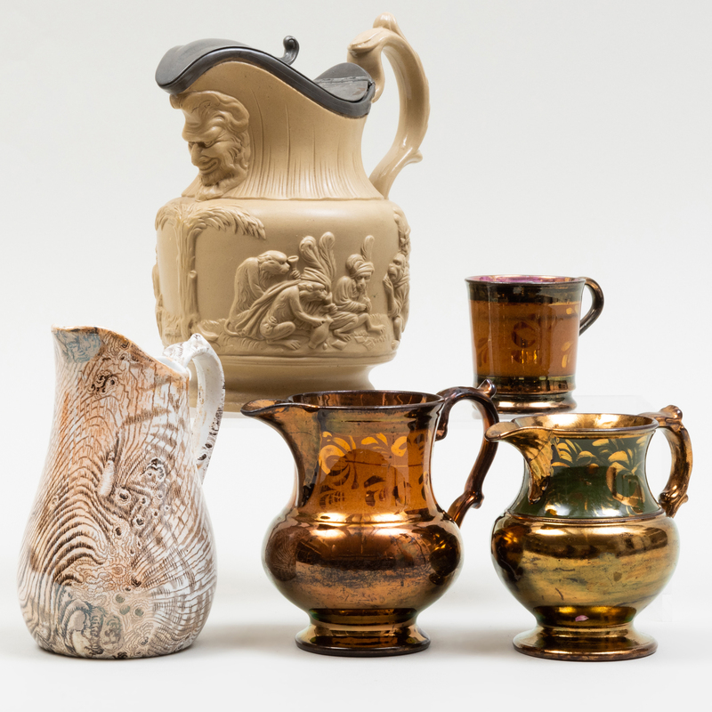 Appraisal: GROUP OF FOUR PITCHERS AND A MUG Comprising A pewter