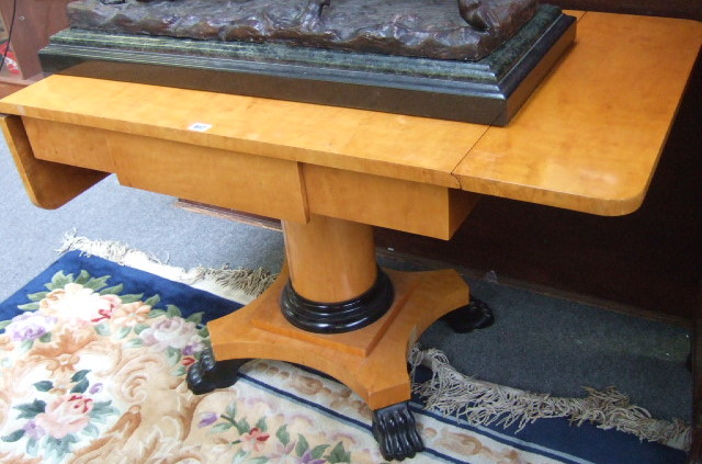 Appraisal: An early th century satinwood sofa table of Biedermeier design