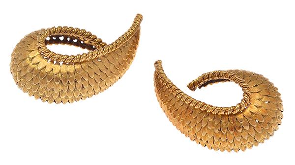 Appraisal: A PAIR OF COCKTAIL EARRINGS Each earring of textured scroll