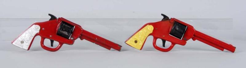 Appraisal: Lot of Red Ranger Pressed Steel Cap Guns Description Both