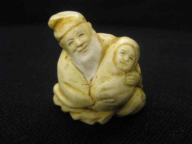 Appraisal: Chinese Ivory Netsuke Old Man with baby '' excellent