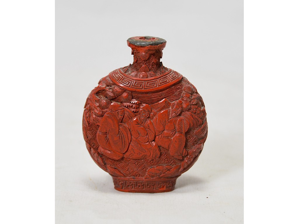 Appraisal: A Chinese cinnabar lacquer moonflash snuff bottle carved with figures