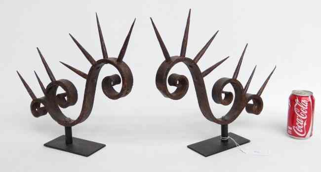 Appraisal: Pair folky painted cast iron window guards '' Length ''