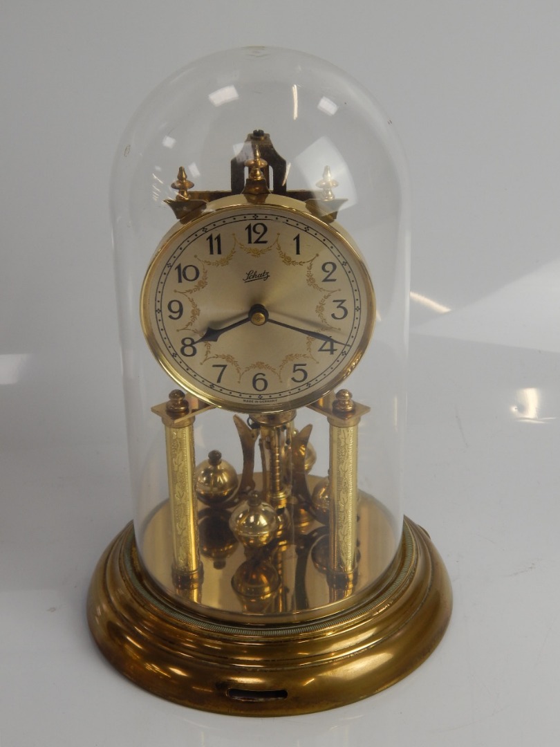 Appraisal: A Schatz brass day clock with glass dome cm high