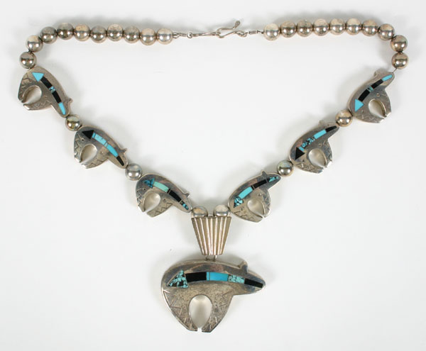 Appraisal: Native American sterling bear necklace with turquoise inlay Artist signed