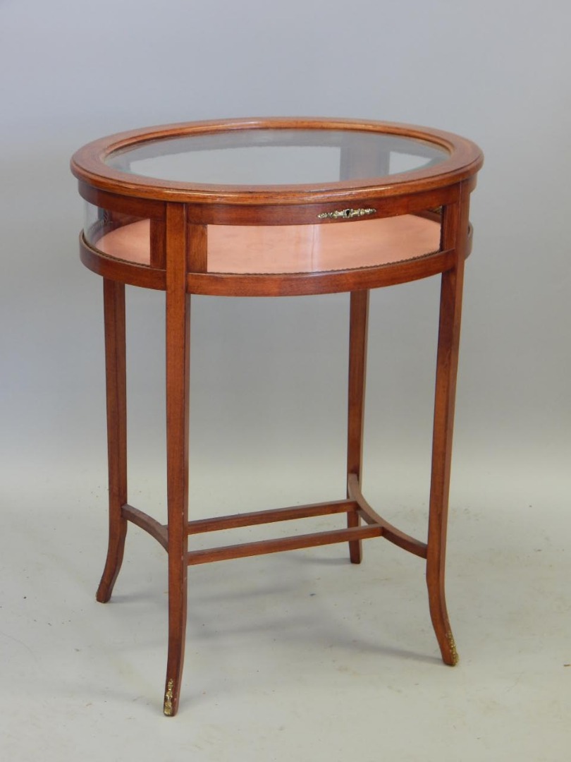 Appraisal: A mahogany and chequer banded display table on splayed legs