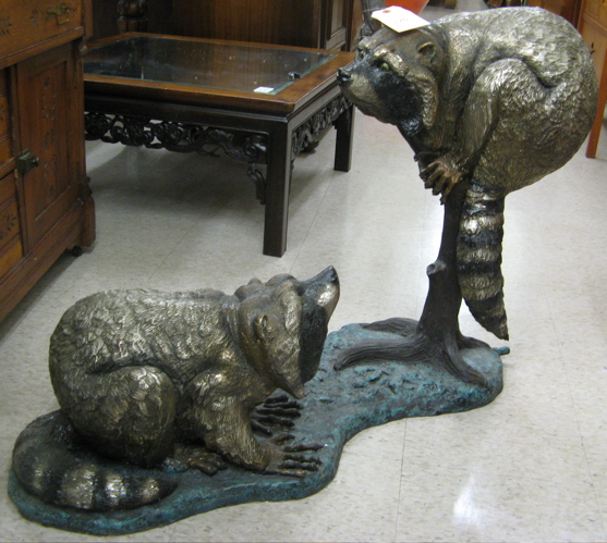 Appraisal: BRONZE WILDLIFE POND SCULPTURE the study of two raccoons with