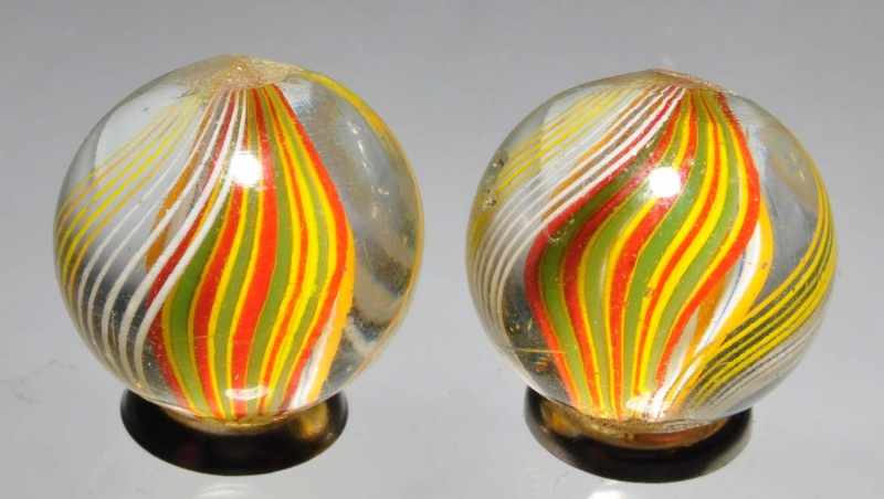 Appraisal: Lot of Same Cane Ribbon Swirl Marbles Description In multiple