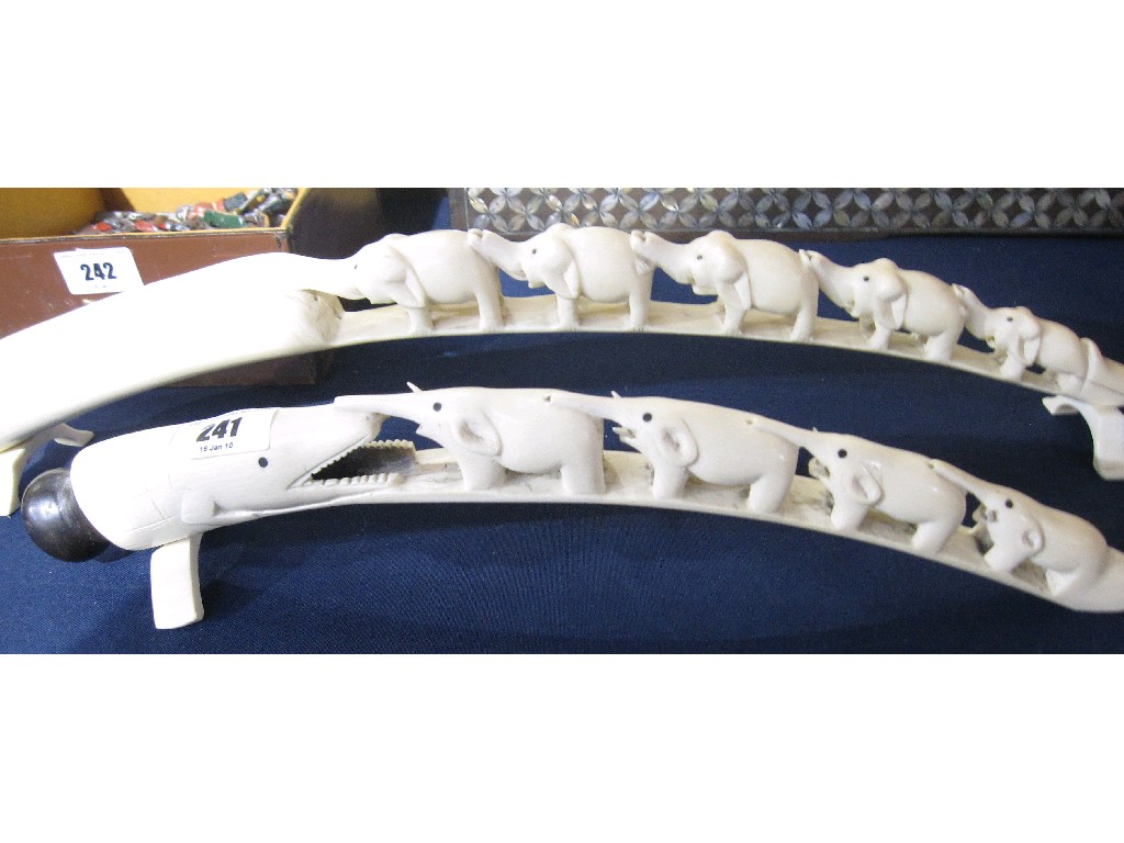 Appraisal: Lot comprising two carved ivory elephant bridges