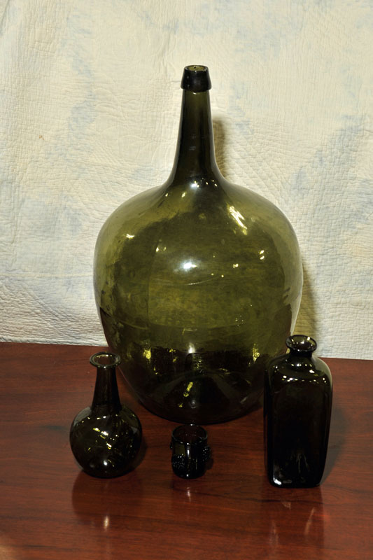 Appraisal: FOUR PIECES BLOWN GLASS All in Olive color Two bottles