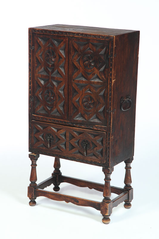 Appraisal: CARVED CUPBOARD ON STAND England th century mixed woods Two