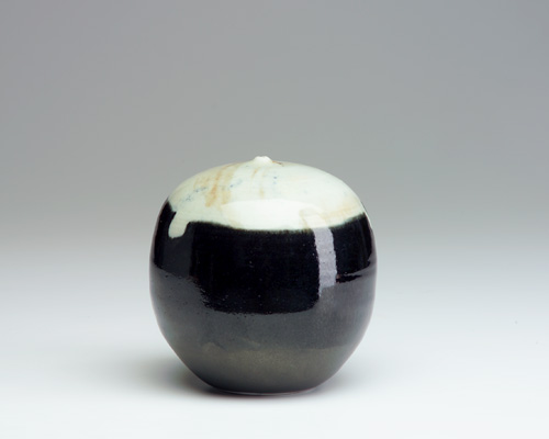 Appraisal: TOSHIKO TAKAEZU Porcelain Moon pot covered in white and black