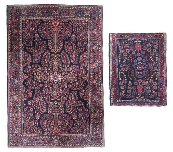 Appraisal: Two Persian Wool Mats each with navy ground Largest feet