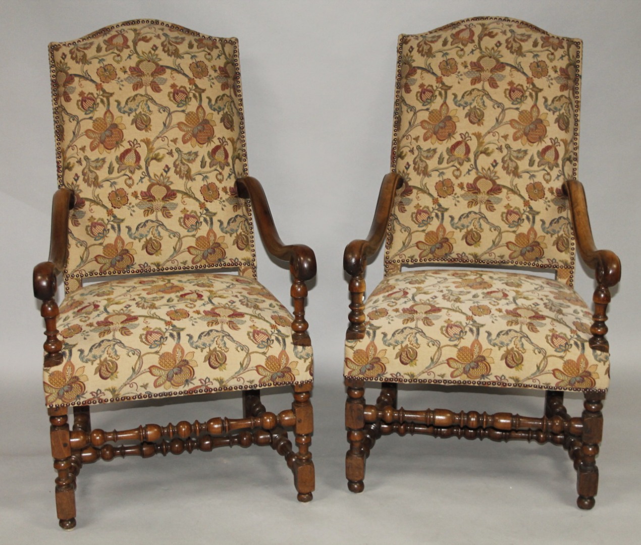 Appraisal: A pair of William and Mary style walnut armchairs with