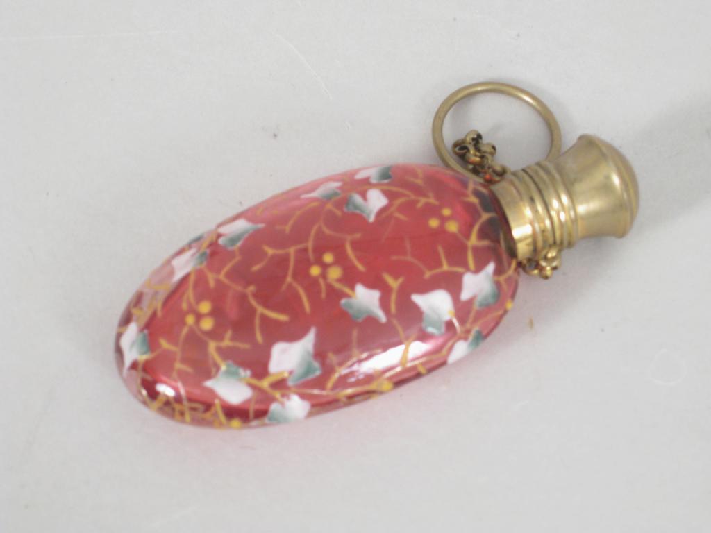 Appraisal: A small oval pink glass Scent Bottle enamelled with leafage