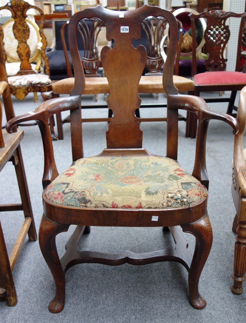 Appraisal: An early th century oak and walnut open armchair with