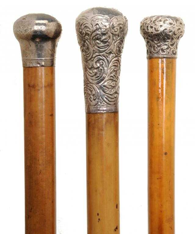 Appraisal: TWO SILVER-MOUNTED MALACCA WALKING CANES AND AN OFFICER'S CANE with