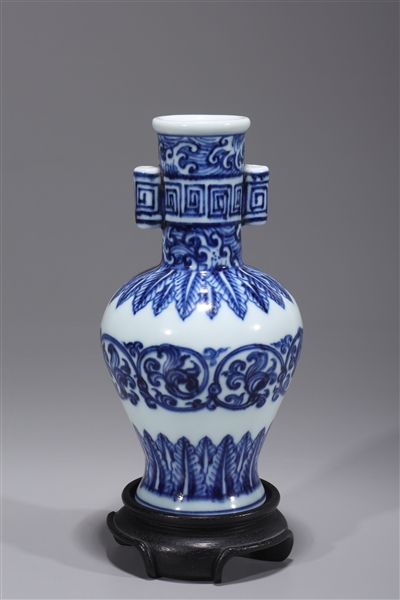 Appraisal: Chinese blue and white porcelain vase floral designs wood stand